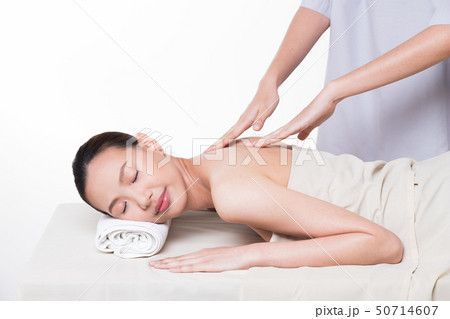 Body Massage on specific naked back of Asian woman by pressing fingers on pain or stress muscle point to release relax. Therapist Spa body massage woman hands treatment on customer, isolated on whit Body Massage on specific naked back of Asian woman by pressing fingers on pain or stress muscle point to release relax. Therapist Spa body massage woman hands treatment on customer, isolated on whit 50714607