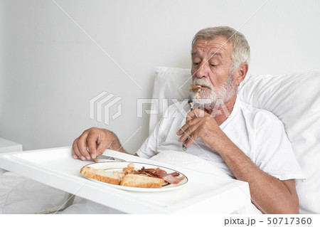 senior man with smiling nurse, takes care senior man with smiling nurse, takes care 50717360