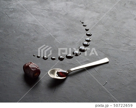 date and dates syrup poured in the shape of moon 50722659