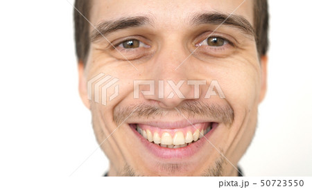Face of young attractive successful smiling man on a white background Face of young attractive successful smiling man on a white background 50723550