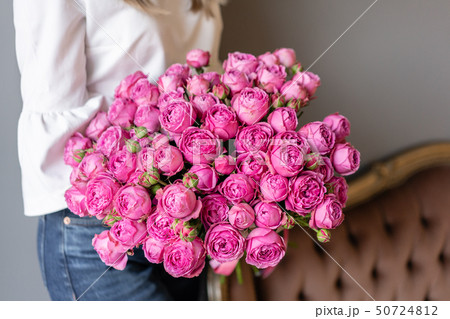 Bush roses, Pink peony in womans hand. Beautiful peony flower for catalog or online store. Beautiful 50724812