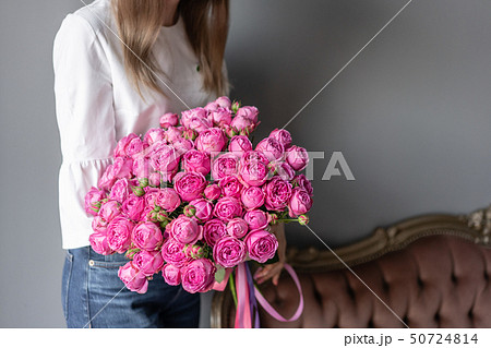 Bush roses, Pink peony in womans hand. Beautiful peony flower for catalog or online store. Beautiful 50724814