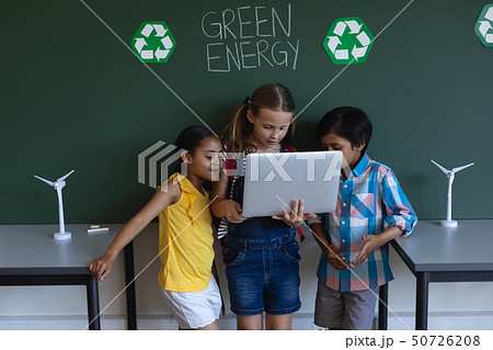 Schoolkids studying on laptop in classroom Schoolkids studying on laptop in classroom 50726208