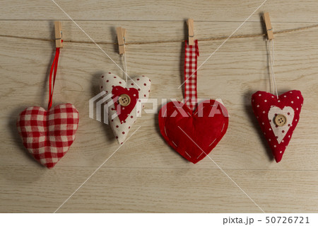 Heart shape decorations hanging on thread 50726721