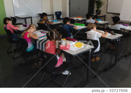 Kids studying in classroom 50727006