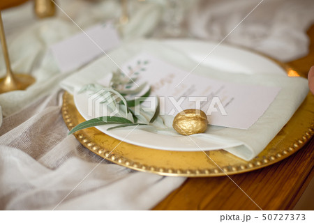 Rustic wedding table set. vintage dining table with decorations, flowers. Boho style. Table set for 50727373