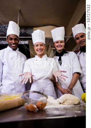 Female chef preparing food in kitchen Female chef preparing food in kitchen 50727532