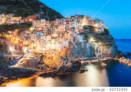 Stunning view of the beautiful and cozy village of Manarola in the Cinque Terre Reserve at sunset. 50733305