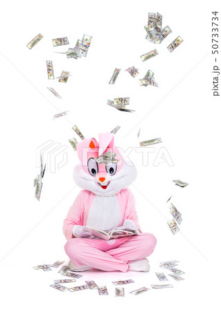 Hundred dollar bills money falls from sky. Lucky person under rain of dollars. Businessman is 50733734