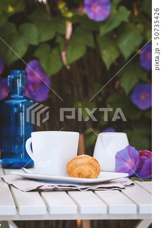 Delicious croissants with coffee Delicious croissants with coffee 50735426