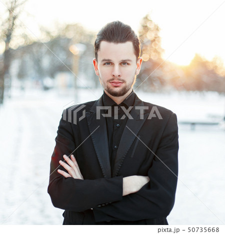 Handsome young man with a beard wearing Handsome young man with a beard wearing 50735668