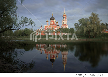 Resurrection Cathedral in Staraya Russa is reflected in the river. Spring landscape. Resurrection Cathedral in Staraya Russa is reflected in the river. Spring landscape. 50736749