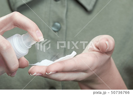 The girl clicks on the nail spray. Concept of Handcare Healthcare Nailcare. Beautiful Natural Nails 50736766