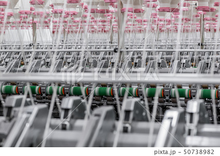 spools of thread at a textile factory 50738982