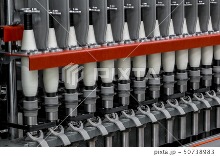 spools of thread at a textile factory 50738983