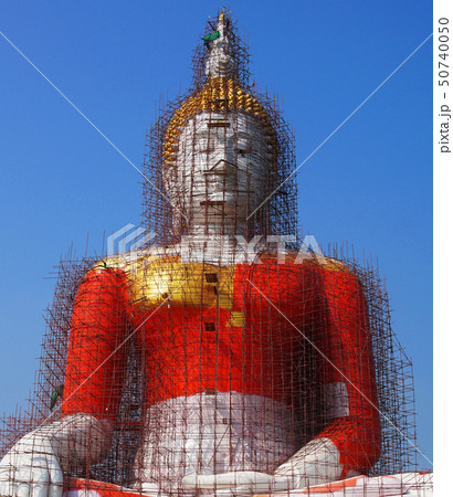 The Buddha statue is under repair in thai temple. The Buddha statue is under repair in thai temple. 50740050