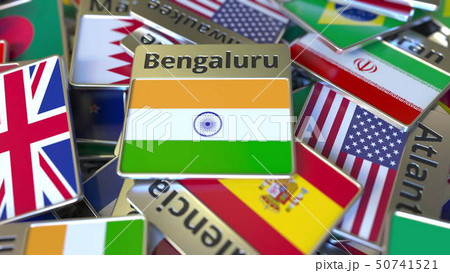 Souvenir magnet or badge with Bengaluru text and national flag among different ones. Traveling to 50741521