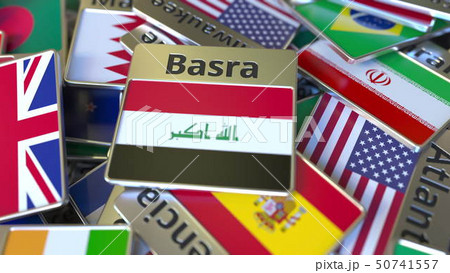Souvenir magnet or badge with Basra text and national flag among different ones. Traveling to Iraq Souvenir magnet or badge with Basra text and national flag among different ones. Traveling to Iraq 50741557