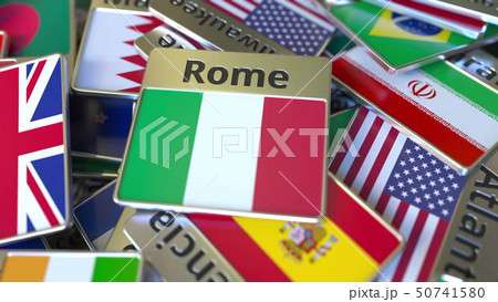 Souvenir magnet or badge with Rome text and national flag among different ones. Traveling to Italy Souvenir magnet or badge with Rome text and national flag among different ones. Traveling to Italy 50741580