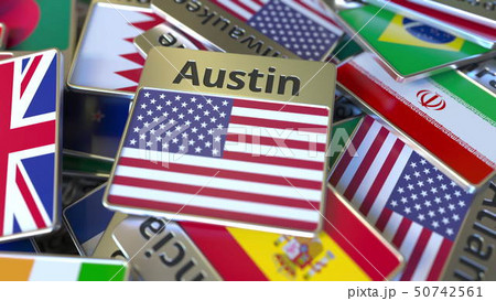 Souvenir magnet or badge with Austin text and national flag among different ones. Traveling to the Souvenir magnet or badge with Austin text and national flag among different ones. Traveling to the 50742561