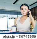 Businesswoman handling office management and lead  50742969