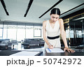 Business woman signing agreement.  Business contra 50742972