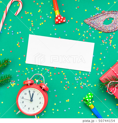 Christmas pattern flat lay with red alarm clock Christmas pattern flat lay with red alarm clock 50744154