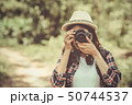 Tourist girl joyful capturing the moment 50744537