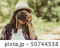 Tourist girl joyful capturing the moment 50744538