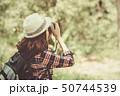 Tourist girl joyful capturing the moment 50744539