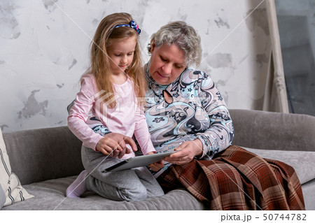 Grandmother and her little granddaughter Grandmother and her little granddaughter 50744782