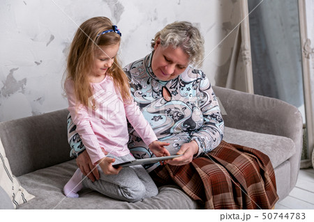 Grandmother and her little granddaughter 50744783