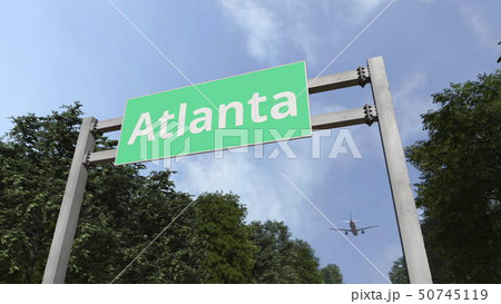 Airplane flies above road sign of Atlanta, United States. 3D rendering 50745119