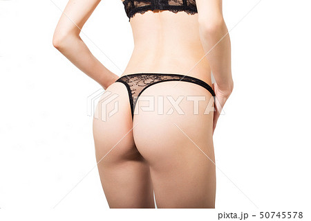 Sexy beautiful booty in black underwear on a white background Sexy beautiful booty in black underwear on a white background 50745578