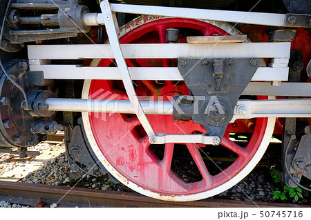 Vintage steam locomotive detail with cranks and red wheels Vintage steam locomotive detail with cranks and red wheels 50745716