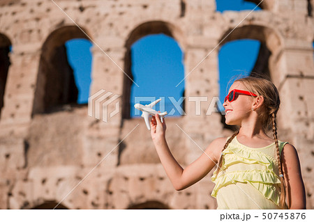 Young girl in front of Colosseum in rome, italy 50745876