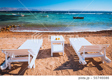 lounge chairs on beautiful tropical beach at Egypt lounge chairs on beautiful tropical beach at Egypt 50746086