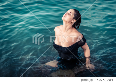 Portrait of a beautiful woman in a sea Portrait of a beautiful woman in a sea 50751784