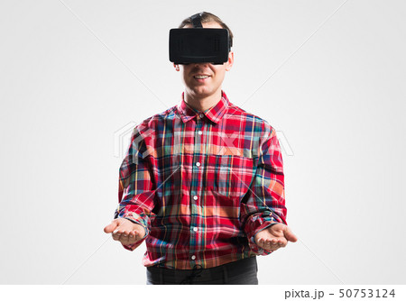 Guy in mask experiencing virtual reality as new entertainment device 50753124