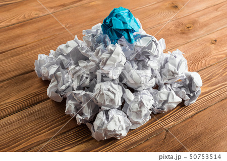 Concept of creativity and inspiration presented by many white paperballs and one color Concept of creativity and inspiration presented by many white paperballs and one color 50753514