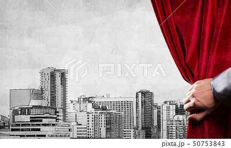 Drawn modern cityscape behind drapery curtain and hand opening it Drawn modern cityscape behind drapery curtain and hand opening it 50753843