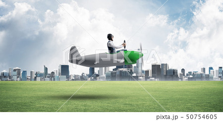 Businessman in aviator hat and goggles Businessman in aviator hat and goggles 50754605