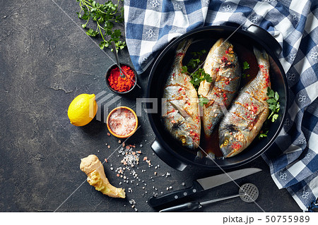 Raw dorado fishies marinated with spices, flatlay Raw dorado fishies marinated with spices, flatlay 50755989