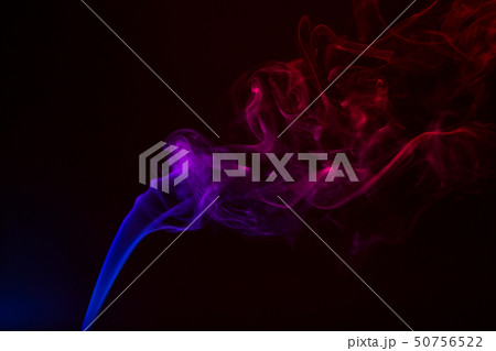 Colorful smoke close-up on a black background Colorful smoke close-up on a black background 50756522