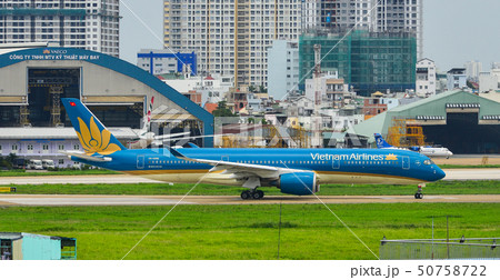 Passenger airplane taxiing on runway 50758722