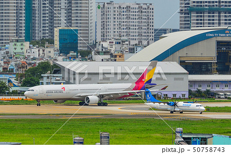 Passenger airplane taxiing on runway 50758743