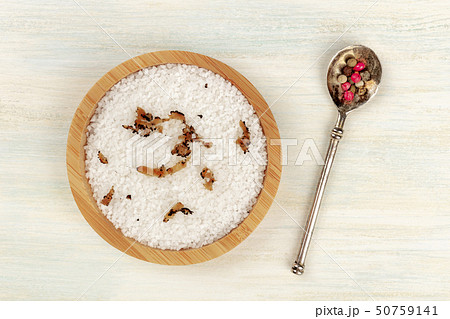 Gourmet spices. A bowl of sea salt infused with truffle shavings and a pepper mix, shot from the top Gourmet spices. A bowl of sea salt infused with truffle shavings and a pepper mix, shot from the top 50759141