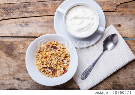 Healthy breakfast background. Muesli with yoghurt 50760571