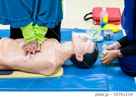hand Heart pump with medical dummy on CPR 50761259