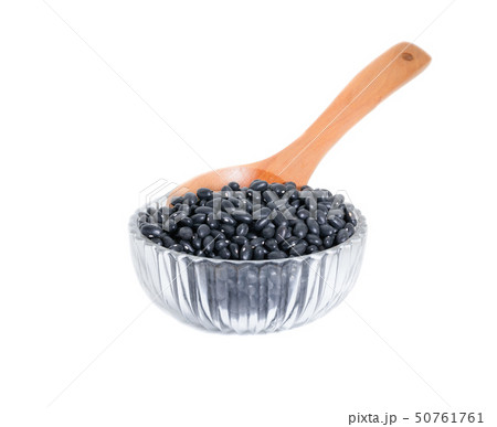 black beans with wooden spoon in clear Glass bowl 50761761